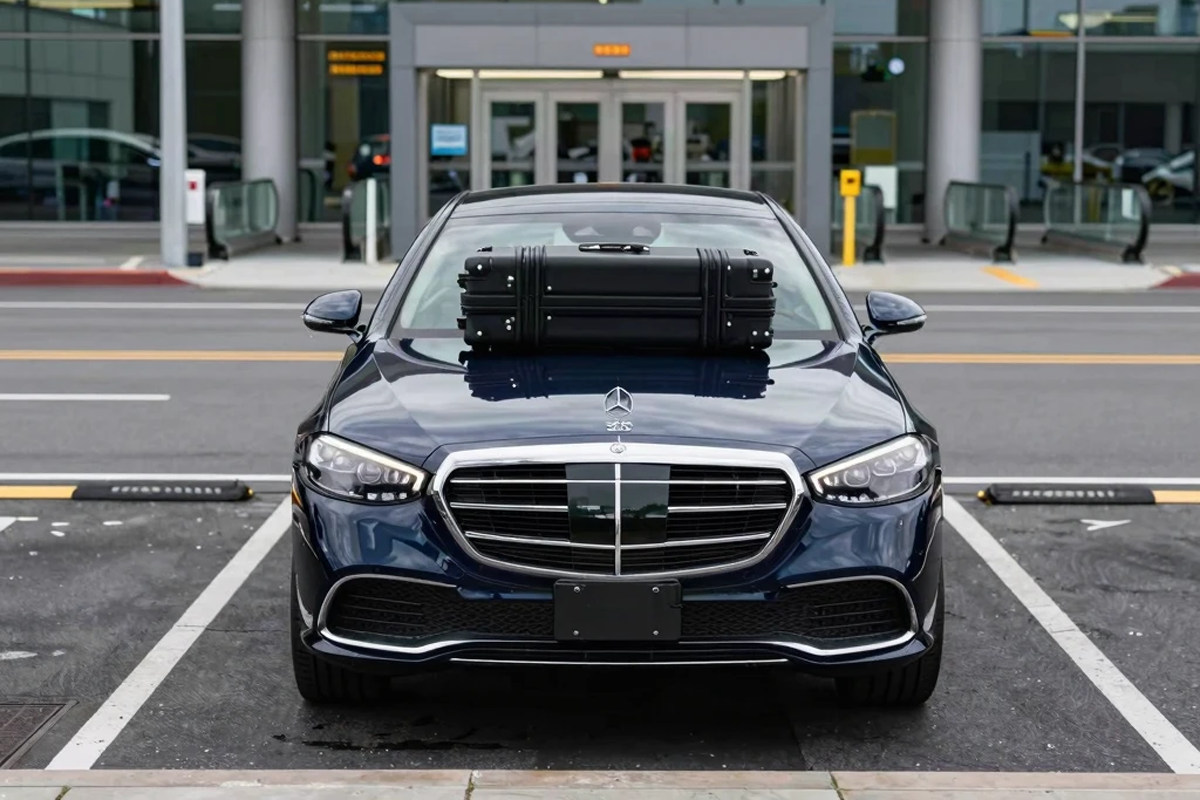 A luxury Mercedes-Benz S-Class S 580 parked at the terminal, providing reliable Midway Airport limo service for a business traveler.