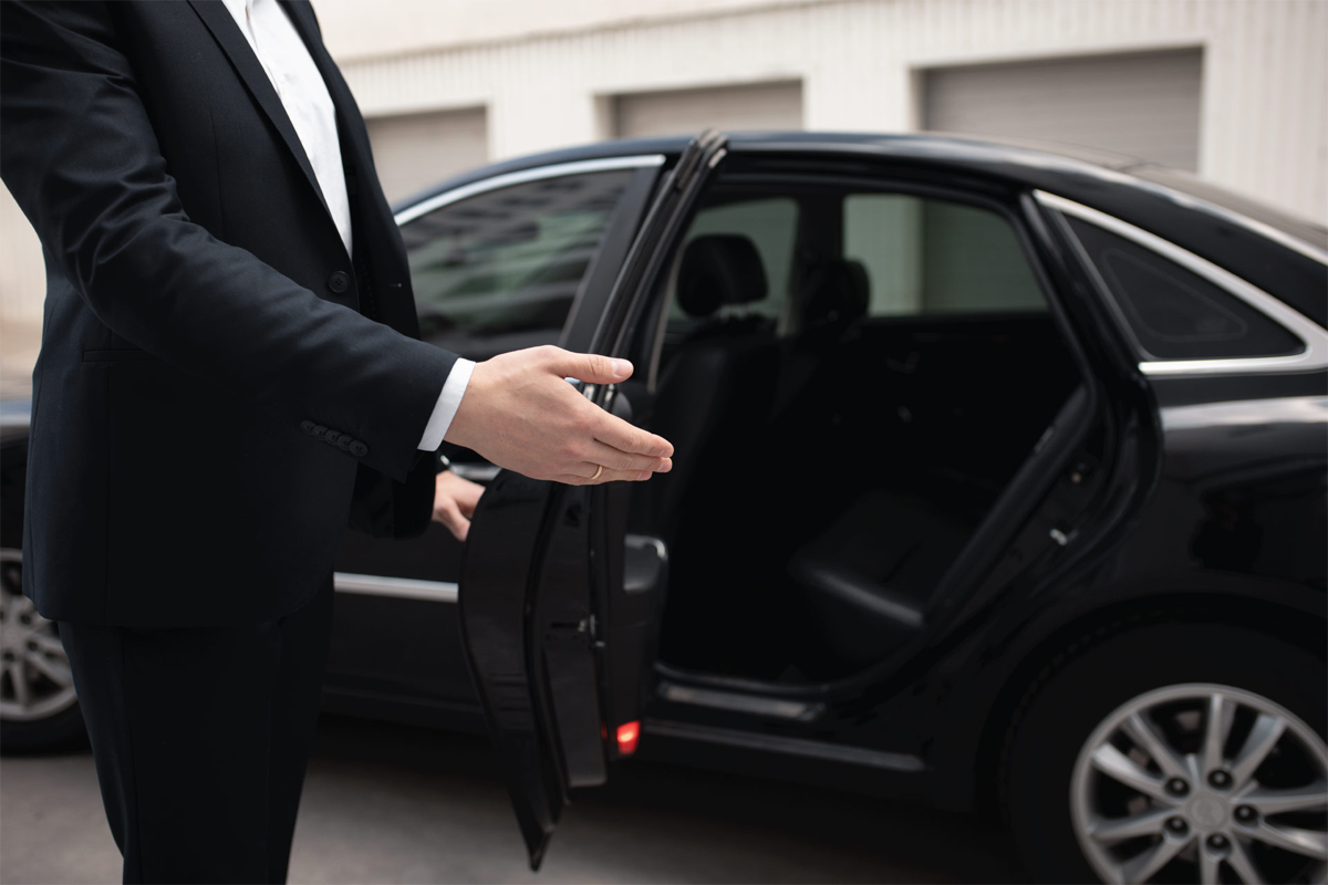 About Chicago Luxury Limo Service professional chauffeur assisting executive travelers