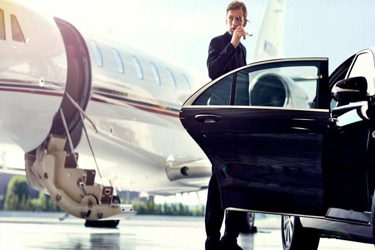 Uniformed chauffeur providing Orland Park to O'Hare Limo airport transfer service